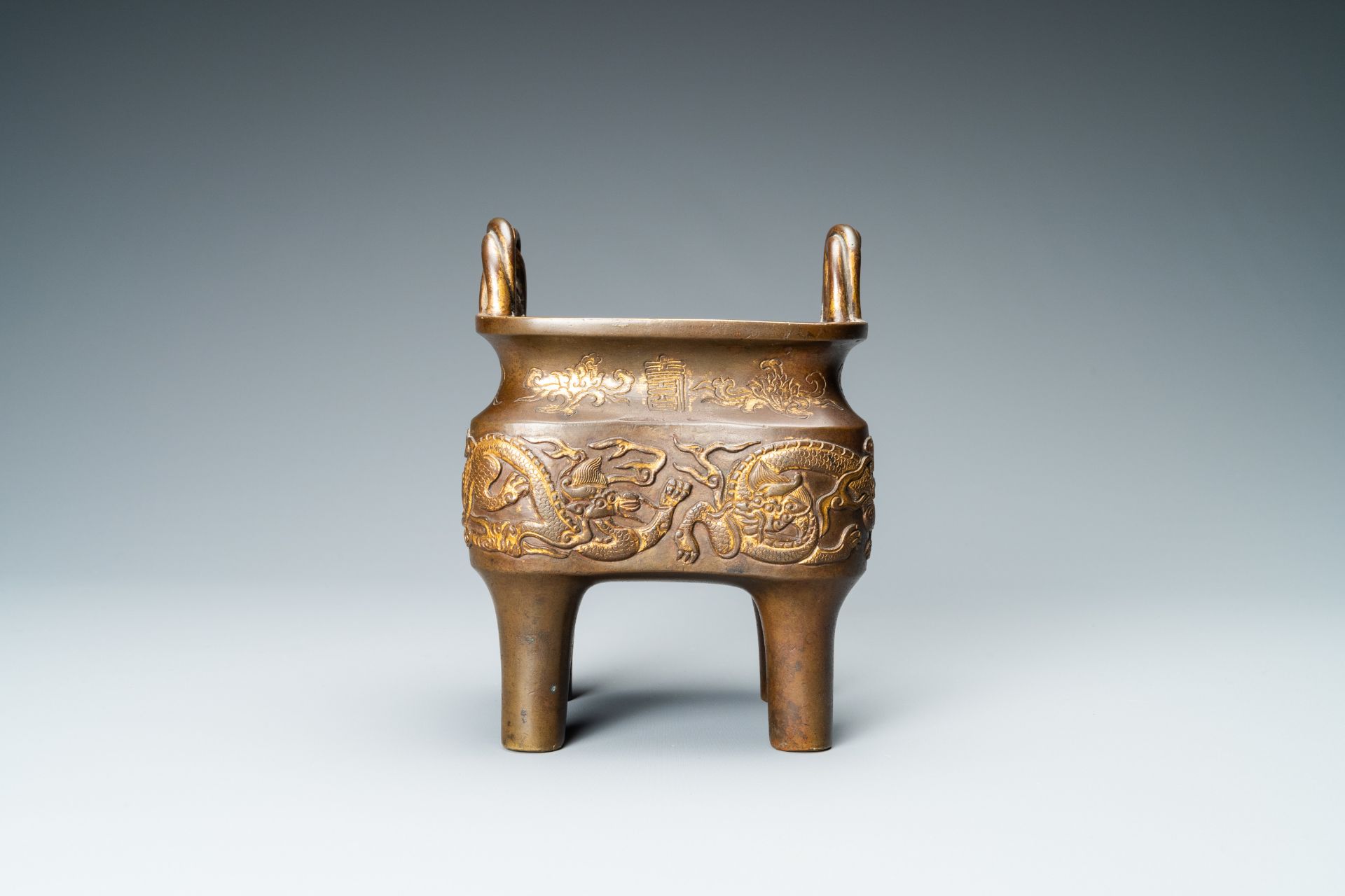 A Chinese partly gilded bronze censer with jade-topped wooden cover, Xuande mark, Kangxi - Image 4 of 17