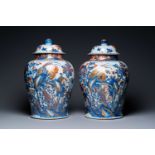 A pair of large Chinese gilded Imari-style vases and covers, Kangxi