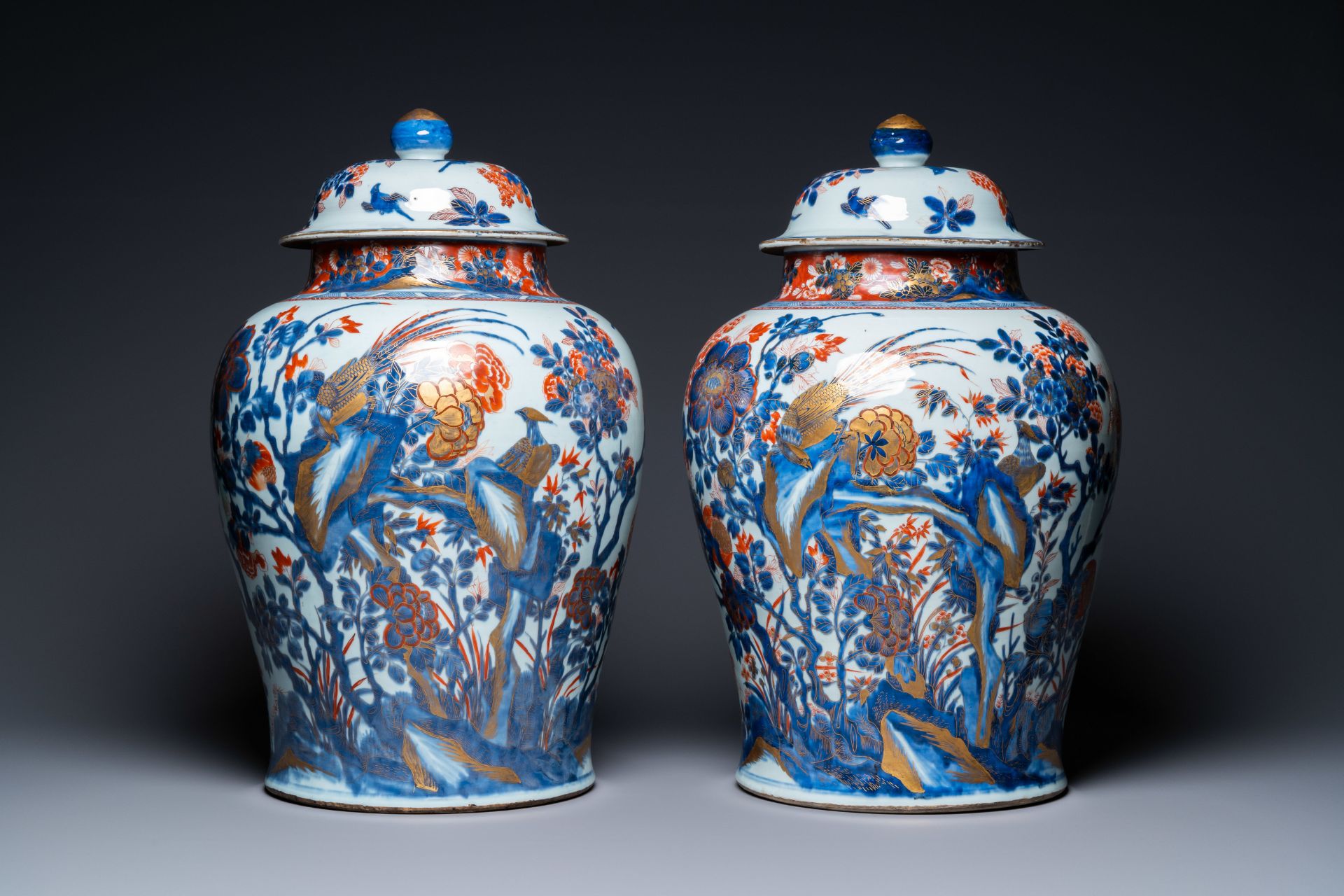 A pair of large Chinese gilded Imari-style vases and covers, Kangxi