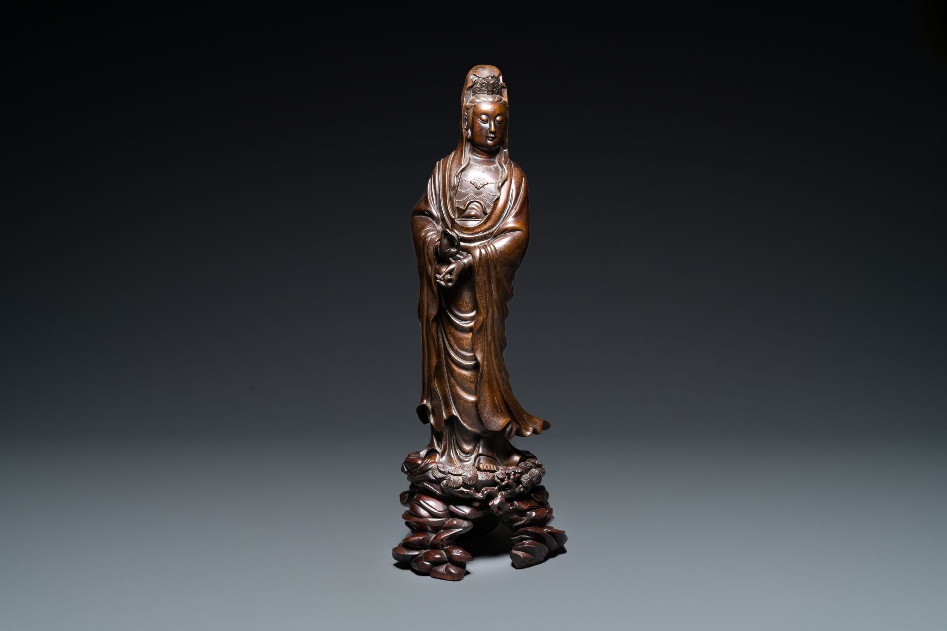 An exceptionally large Chinese silver-inlaid bronze figure of Guanyin, Yutang Shi Sou mark, Qing