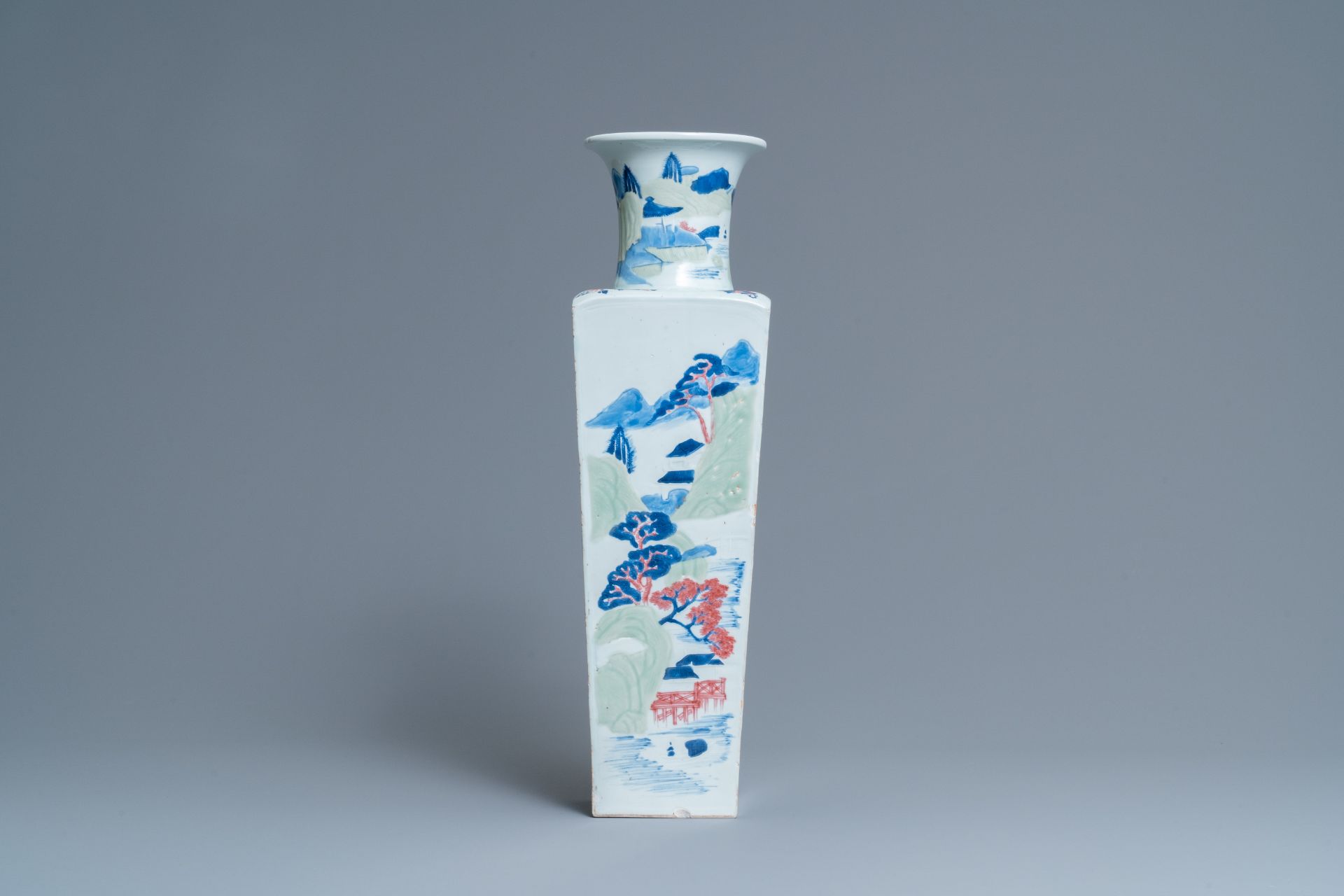 A Chinese blue and white, celadon and copper-red tapering square vase with landscape panels, Kangxi