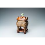 A Chinese partly gilded bronze censer with jade-topped wooden cover, Xuande mark, Kangxi