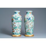 A pair of Chinese famille verte 'mythical animals' vases, Kangxi