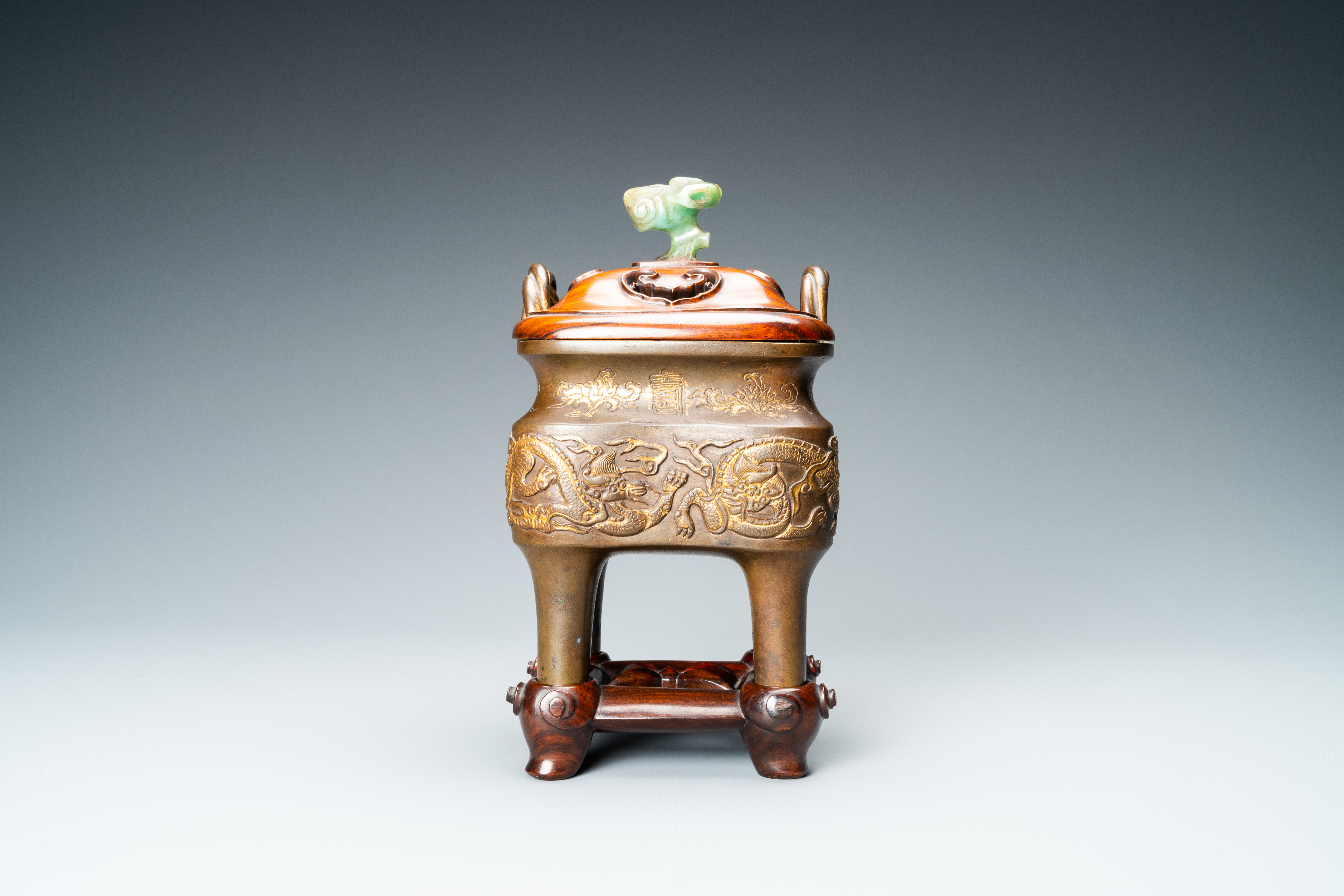 A Chinese partly gilded bronze censer with jade-topped wooden cover, Xuande mark, Kangxi - Image 3 of 17