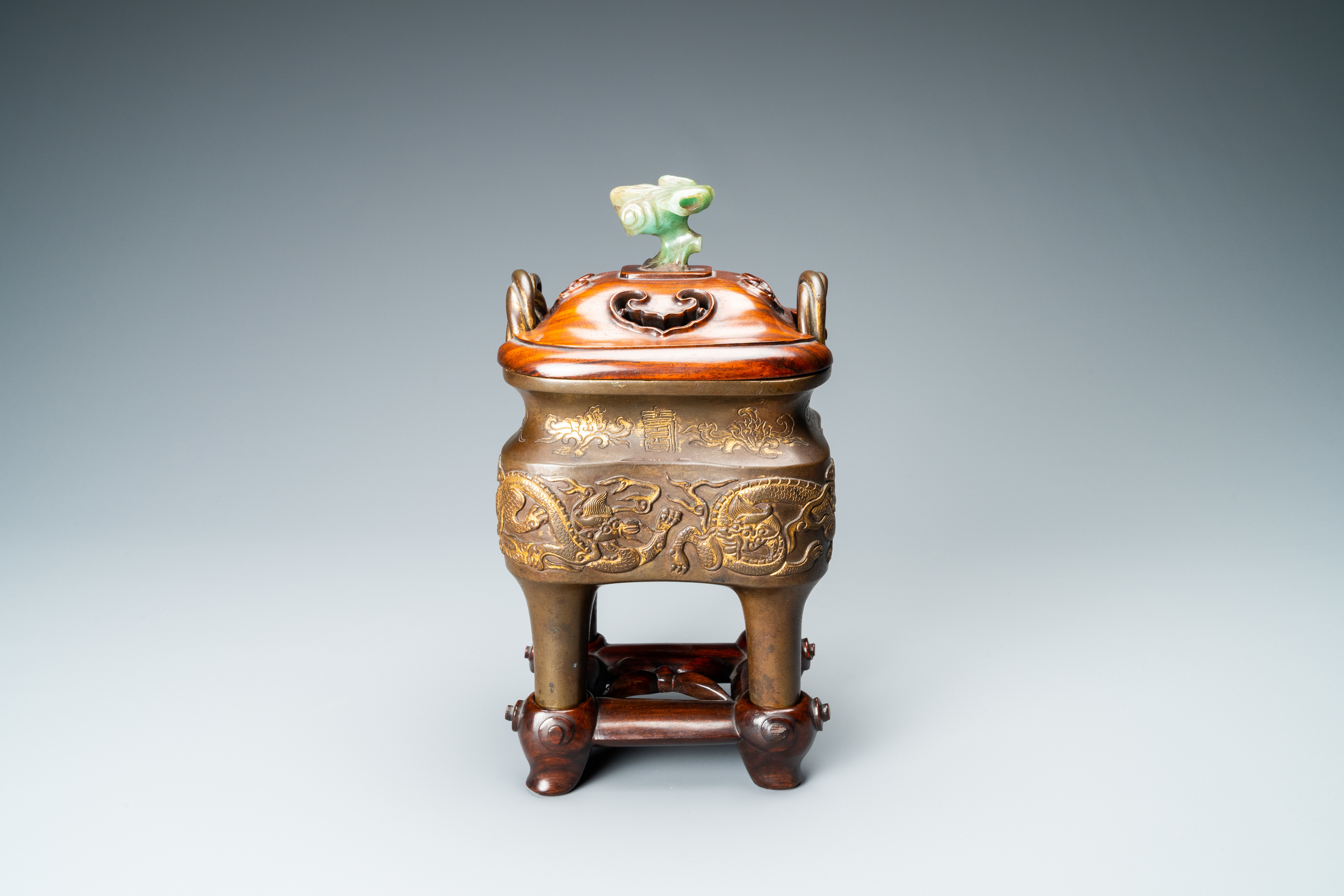 A Chinese partly gilded bronze censer with jade-topped wooden cover, Xuande mark, Kangxi - Image 2 of 17