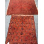EASTERN STYLE RED GROUND SCATTER RUGS (2) multi-bordered with repeating central block patterns,
