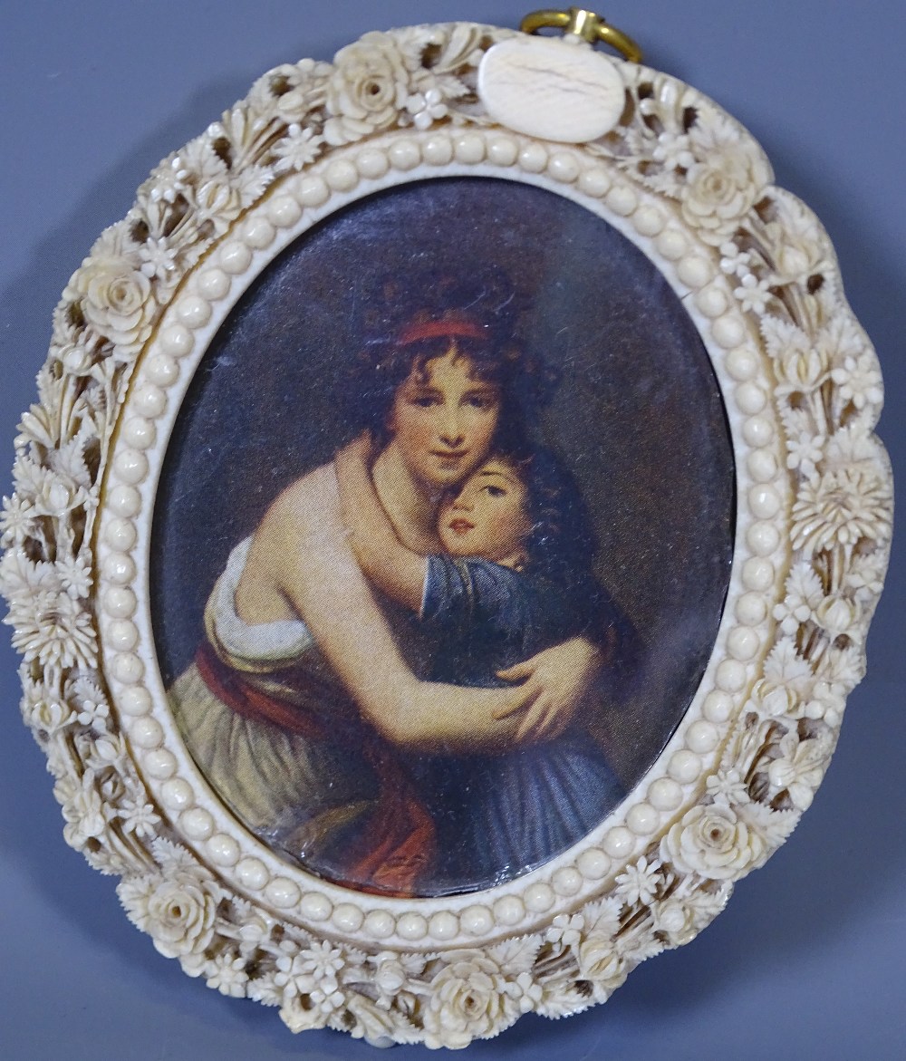 PAIR OF OVAL, 19TH CENTURY IVORY FRAMES and a brass example, one containing a painted porcelain - Image 2 of 4