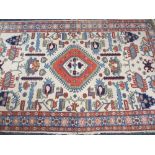 THREE EASTERN STYLE WOOLLEN CARPETS, various colours and sizes with traditional patterning, the