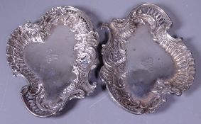 A PAIR OF SILVER DISHES, of pierced shape and scroll form, each bearing initial, 2.9ozs,
