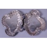 A PAIR OF SILVER DISHES, of pierced shape and scroll form, each bearing initial, 2.9ozs,