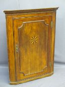 INLAID MAHOGANY CORNER HANGING WALL CUPBOARD with Starburst detail to a single door with interior