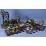 BRASS MODELS DEPICTING MINING SCENES all on wooden plinths (4)