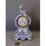 ROYAL BONN BLUE & WHITE DELFT ENCASED MANTEL CLOCK of waisted and scrolled form with windmill
