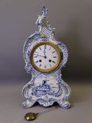 ROYAL BONN BLUE & WHITE DELFT ENCASED MANTEL CLOCK of waisted and scrolled form with windmill