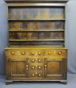 MID 19TH CENTURY NORTH WALES DRESSER, oak and pine sided, the three shelf rack with wide bordered