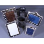 THREE SILVER PHOTO FRAMES, one EPNS example and two one pint pewter tankards