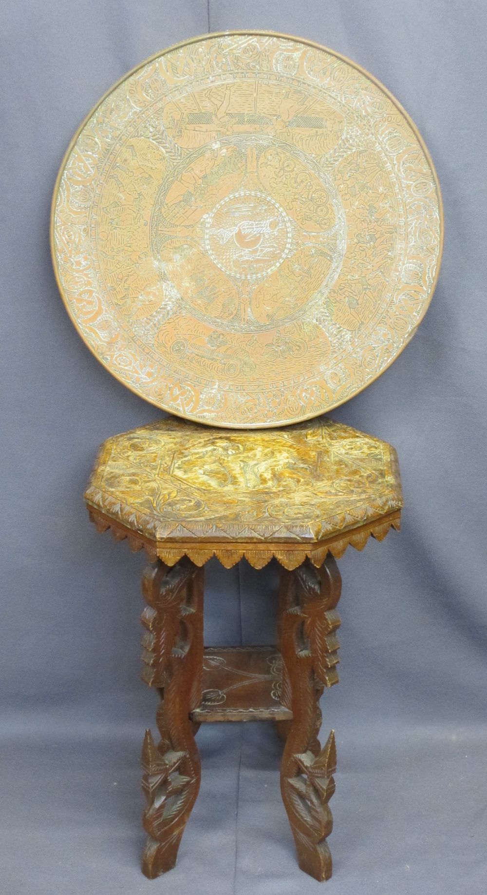 HIGHLY UNUSUAL BRASS TABLETOP and a carved Indian two-tier side table, the Benares style brass top