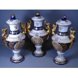 CONTINENTAL LIDDED VASE TRIO, 42cms tall