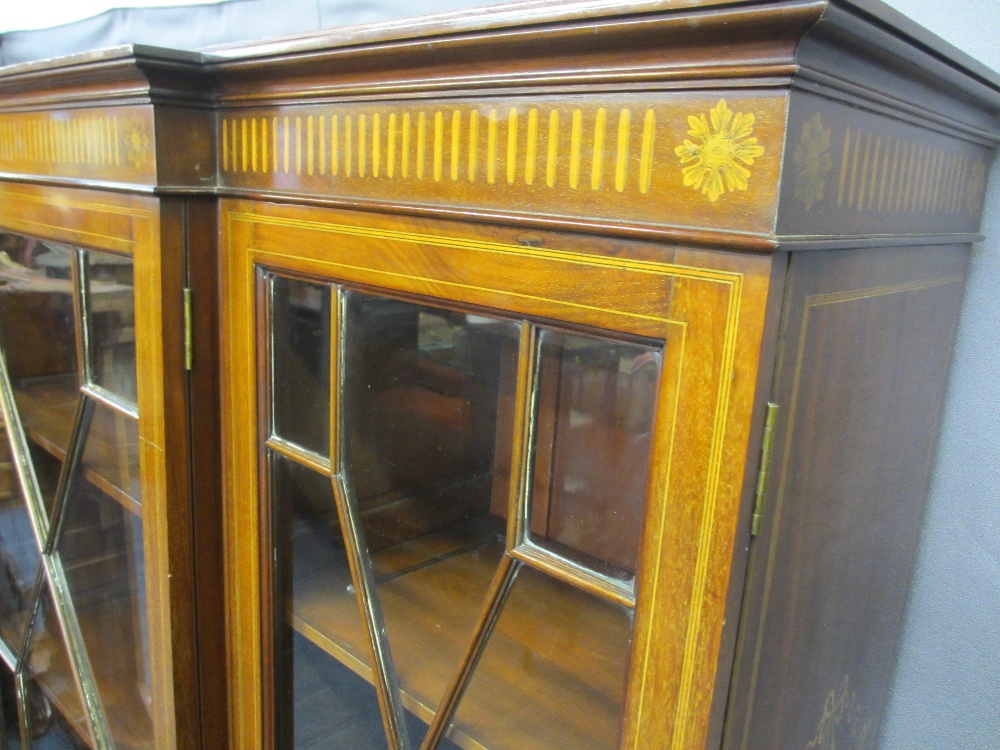 EDWARDIAN SHERATON STYLE INLAID BREAKFRONT BOOKCASE/CABINET having three lower drawers on square - Image 5 of 5