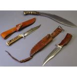 THREE HUNTING KNIVES including a horn handled example with finger guard, the blade marked '