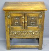 REPRODUCTION OAK HUTCH CUPBOARD having twin doors and lower single drawer, all with carved detail