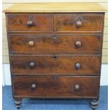 VICTORIAN MAHOGANY CHEST of two short over three long drawers with turned wooden knobs on bun