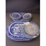 BLUE & WHITE POTTERY PART DRESSER SET, mainly Willow pattern including five meat platters
