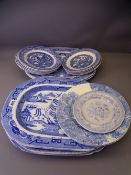 BLUE & WHITE POTTERY PART DRESSER SET, mainly Willow pattern including five meat platters