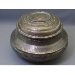 A LARGE PERSIAN COPPER CIRCULAR STEPPED CONTAINER WITH LID, 30cms diameter, 22cms H