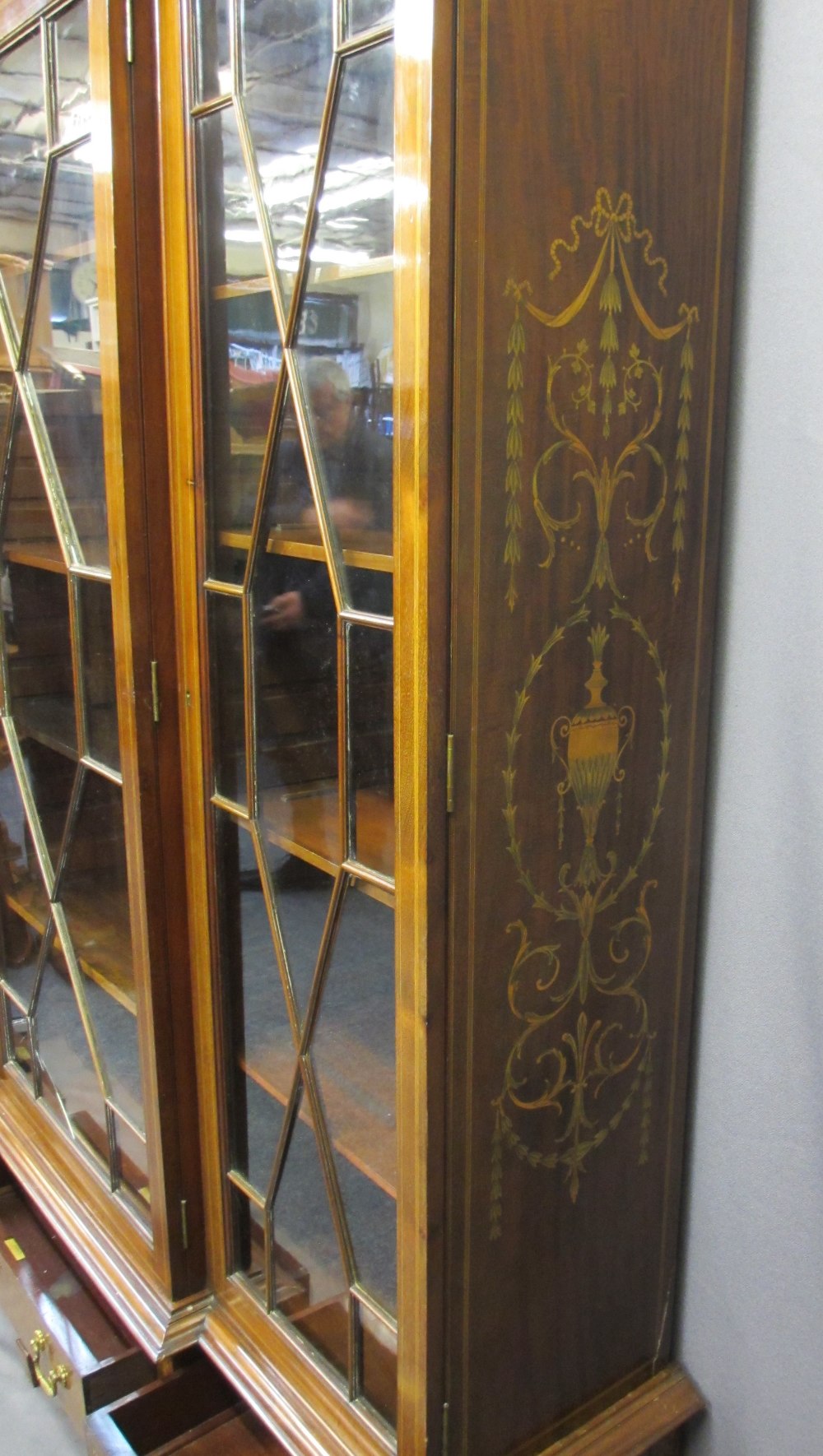 EDWARDIAN SHERATON STYLE INLAID BREAKFRONT BOOKCASE/CABINET having three lower drawers on square - Image 4 of 5