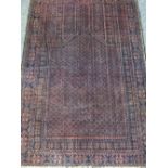OLD BALUCHI RUG deep red and blue ground with multi-bordered edging, 138 x 92cms