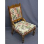 EDWARDIAN RE-UPHOLSTERED PARLOUR CHAIR on turned front supports and castors, 92cms H, 51cms max W,