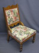 EDWARDIAN RE-UPHOLSTERED PARLOUR CHAIR on turned front supports and castors, 92cms H, 51cms max W,