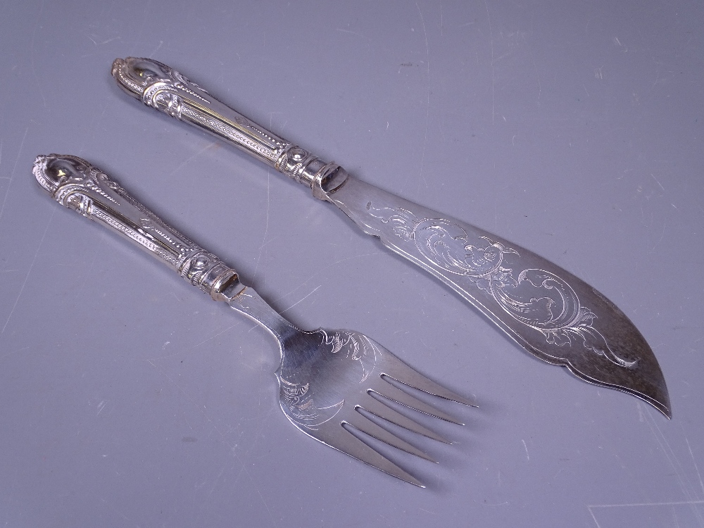 A PAIR OF FISH SERVERS, unboxed, with attractive, possibly silver beadwork handles, each handle