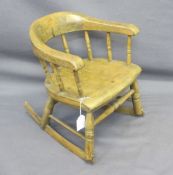 CHILD'S ROCKING ARMCHAIR, Victorian with spindle gallery bow back, 40cms H, 34cms max W, 26cms