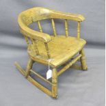 CHILD'S ROCKING ARMCHAIR, Victorian with spindle gallery bow back, 40cms H, 34cms max W, 26cms