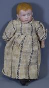 A SMALL BISQUE HEADED ANTIQUE DOLL, (A/F), 25cms L