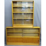 TWO VINTAGE TEAK SLIDING DOOR BOOKCASES, one being fully glass fronted, 112.5cms H, 91cms W, 24cms