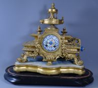 MANTEL CLOCK - French gilt metal on a base and wooden plinth for a dome, (glass not present),