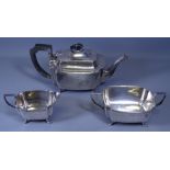 THREE PIECE SILVER TEA SERVICE - each piece of oblong plain form with concave corners and on