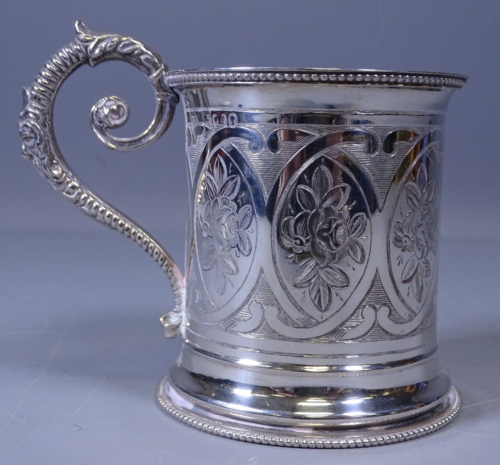 VICTORIAN SILVER TANKARD, attractively floral decorated with beadwork edging and scrolled handle