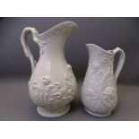 TWO JUGS - a handsome tall semi-glazed 19th century narrow necked Staffordshire jug with floral
