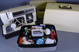 TOYOTA STRETCH STITCH CASED SEWING MACHINE E/T and a haberdashery box with contents