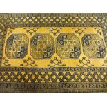 EASTERN STYLE WOOLLEN CARPETS (2) including an antique style Ochre ground example, patterned in