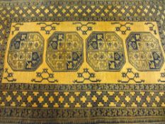 EASTERN STYLE WOOLLEN CARPETS (2) including an antique style Ochre ground example, patterned in