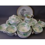 VICTORIAN 23 PIECE TEASET in green floral transfer consisting six cups, saucers and side plates,