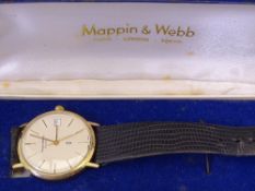 A GENT'S 9CT GOLD MAPPIN & WEBB QUARTZ WRISTWATCH with circular dial, leather strap and original box