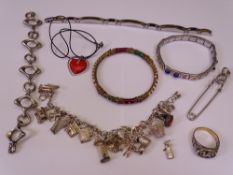 STYLISH, SILVER & GILT METAL JEWELLERY, a quantity including a charm bracelet holding sixteen charms