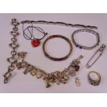 STYLISH, SILVER & GILT METAL JEWELLERY, a quantity including a charm bracelet holding sixteen charms