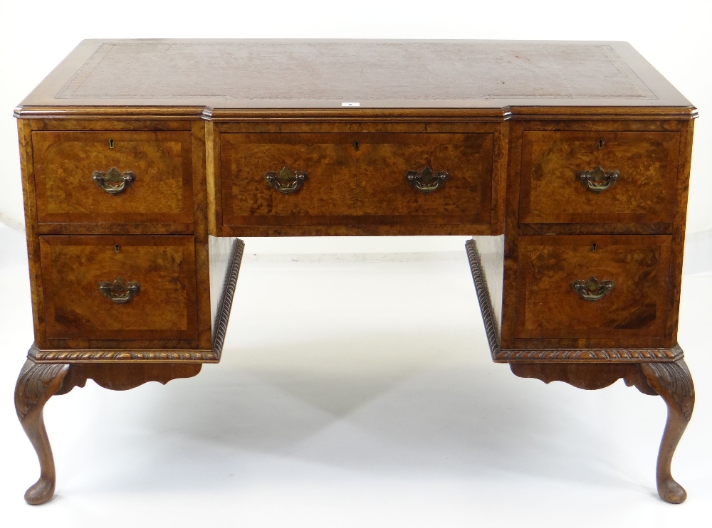 GEORGE II-STYLE BURR WALNUT & MAHOGANY CROSSBANDED KNEEHOLE DESK, red leather inset top above
